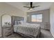 Relax in this bedroom with a ceiling fan, a large bed, and an abundance of natural light from a window at 3005 Stern Dr, Las Vegas, NV 89117