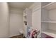 This walk-in closet features built-in shelves and clothing rods for plenty of storage at 3005 Stern Dr, Las Vegas, NV 89117