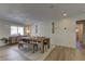 Sunlit dining room featuring modern rustic furniture and stylish decor, perfect for Gathering meals at 3005 Stern Dr, Las Vegas, NV 89117