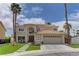 Beautiful two-story home featuring a tile roof, desert landscaping, and a two-car garage at 3005 Stern Dr, Las Vegas, NV 89117