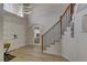 Grand foyer with a staircase, modern lighting, and elegant flooring at 3005 Stern Dr, Las Vegas, NV 89117