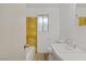 Bathroom with laminate flooring, vanity, and a window at 304 Orland St # 47, Las Vegas, NV 89107