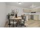 Dining area with round table, seating for four, and adjacent kitchen space at 304 Orland St # 47, Las Vegas, NV 89107