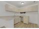 Well-lit kitchen with wood cabinets, laminate flooring, and functional layout at 304 Orland St # 47, Las Vegas, NV 89107
