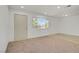 Well-lit living room featuring mixed flooring, neutral paint, and a view to the exterior at 304 Orland St # 47, Las Vegas, NV 89107