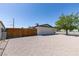 Spacious, low-maintenance backyard with gravel groundcover and wood fencing, perfect for outdoor activities at 3040 Carroll St, North Las Vegas, NV 89030