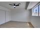 Bright bedroom featuring wood floors, a ceiling fan, and a closet at 3040 Carroll St, North Las Vegas, NV 89030