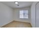 This bedroom features wood floors, a window with blinds, and a sliding door closet at 3040 Carroll St, North Las Vegas, NV 89030