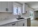 Beautifully updated kitchen with quartz countertops, stainless steel appliances, and white cabinetry at 3040 Carroll St, North Las Vegas, NV 89030
