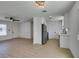 Modern kitchen featuring white cabinets, stainless steel appliances, and open access to the living space at 3040 Carroll St, North Las Vegas, NV 89030