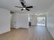 Open-concept living room flows into the kitchen, boasting wood floors and access to the backyard at 3040 Carroll St, North Las Vegas, NV 89030