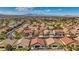 View of a well-planned neighborhood with sidewalks, palm trees, and desert landscaping at 3091 Via Del Corso, Henderson, NV 89052
