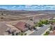An aerial view of a beautiful neighborhood near a large desert landscape on a sunny day at 3091 Via Del Corso, Henderson, NV 89052