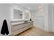 Bright bathroom with a dual vanity, glass shower, and modern fixtures at 3091 Via Del Corso, Henderson, NV 89052