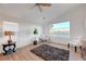Inviting bedroom featuring a modern workspace, hardwood floors, and scenic view at 3091 Via Del Corso, Henderson, NV 89052