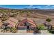 Beautiful single-Gathering home with desert landscaping, a three-car garage, and a red tile roof at 3091 Via Del Corso, Henderson, NV 89052