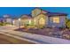 Charming single-Gathering home featuring a three-car garage and desert landscaping at 3091 Via Del Corso, Henderson, NV 89052