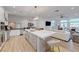 Spacious kitchen island overlooks the cozy living area and bright dining area at 3091 Via Del Corso, Henderson, NV 89052