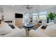 Inviting living room with plush seating, fireplace, and large windows showcasing scenic views at 3091 Via Del Corso, Henderson, NV 89052