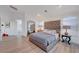 Serene main bedroom features plush furnishings, ample natural light, and a relaxing atmosphere at 3091 Via Del Corso, Henderson, NV 89052