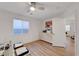 Bright office space featuring a large window, a ceiling fan, a closet, and neutral colors at 3091 Via Del Corso, Henderson, NV 89052