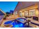 Charming backyard with a pool, jacuzzi, outdoor seating area, and an outdoor kitchen at 3091 Via Del Corso, Henderson, NV 89052