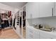 Well-organized walk-in closet with ample storage and mirrored doors at 3091 Via Del Corso, Henderson, NV 89052