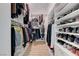 Spacious walk-in closet with custom shelves and ample storage for clothes and shoes at 3091 Via Del Corso, Henderson, NV 89052