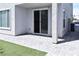 Charming backyard patio featuring artificial grass for easy maintenance and relaxing outdoor living at 3767 Paseo De Paz Ave, Las Vegas, NV 89115