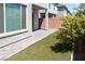 Backyard with a patio, artificial grass, and partial privacy wall offers a low-maintenance outdoor space at 3767 Paseo De Paz Ave, Las Vegas, NV 89115