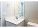 Bathroom featuring white cabinets, sink, and toilet at 3767 Paseo De Paz Ave, Las Vegas, NV 89115