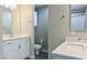 Bathroom featuring white cabinets, dual sinks, and a toilet at 3767 Paseo De Paz Ave, Las Vegas, NV 89115