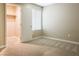 Neutral bedroom featuring plush carpeting, closet, and a window with bright natural light at 3767 Paseo De Paz Ave, Las Vegas, NV 89115