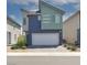 Contemporary two-story home featuring a two-car garage and modern architectural elements at 3767 Paseo De Paz Ave, Las Vegas, NV 89115