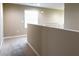 Bright hallway landing with neutral walls, plush carpeting, and a window allowing natural light at 3767 Paseo De Paz Ave, Las Vegas, NV 89115