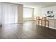 Bright, open living space with hardwood floors and a view into the kitchen area at 3767 Paseo De Paz Ave, Las Vegas, NV 89115