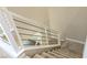 Carpeted staircase features white and metal horizontal railing at 3767 Paseo De Paz Ave, Las Vegas, NV 89115