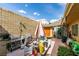 Cozy backyard area with a barbecue, patio umbrella, and shaded patio at 3879 Atlantis St, Las Vegas, NV 89121