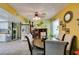 Warm dining area with an oval table and stainless steel refrigerator at 3879 Atlantis St, Las Vegas, NV 89121