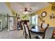 Charming dining area with a ceiling fan and stainless steel refrigerator at 3879 Atlantis St, Las Vegas, NV 89121