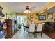 Inviting dining area with decorative wall hangings and view to the living area at 3879 Atlantis St, Las Vegas, NV 89121