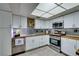 Bright kitchen featuring white cabinets, butcher block countertops, stainless steel appliances, and stylish backsplash at 3879 Atlantis St, Las Vegas, NV 89121