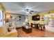Inviting living room with hardwood floors, ceiling fan and open access to the dining area at 3879 Atlantis St, Las Vegas, NV 89121