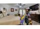 Comfortable main bedroom with a ceiling fan, television, and dresser at 3879 Atlantis St, Las Vegas, NV 89121