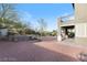 Spacious backyard with rock features, patio area, and mature trees at 3934 Sangre De Cristo Ave, Las Vegas, NV 89118