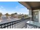 Cozy balcony with wrought iron railing offering views of the gated community and lush landscaping at 3934 Sangre De Cristo Ave, Las Vegas, NV 89118
