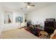 Carpeted bedroom with ceiling fan, natural light, and alcove perfect for music or art at 3934 Sangre De Cristo Ave, Las Vegas, NV 89118