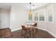 Bright breakfast nook featuring a round table, modern chairs, and natural light from shuttered windows at 3934 Sangre De Cristo Ave, Las Vegas, NV 89118