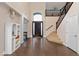 Stunning foyer featuring high ceilings, a modern staircase, stylish decor, and plenty of natural light at 3934 Sangre De Cristo Ave, Las Vegas, NV 89118