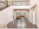 Grand foyer with a staircase, high ceilings, modern decor, and an open view to the living areas at 3934 Sangre De Cristo Ave, Las Vegas, NV 89118